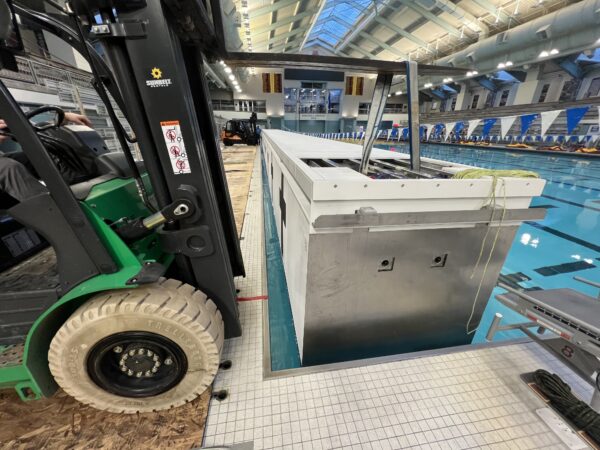 Bulkhead being placed into the pool at the Jean K Freeman Aquatic Center