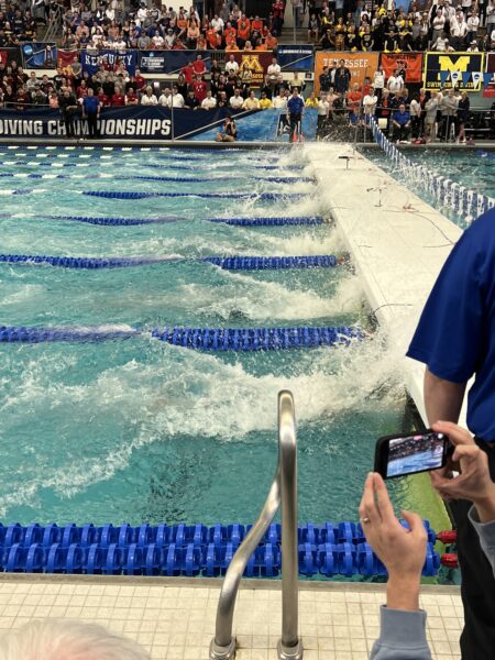 Swimmers touching the Natare bulkhead at the Jean K Freeman Aquatic Center