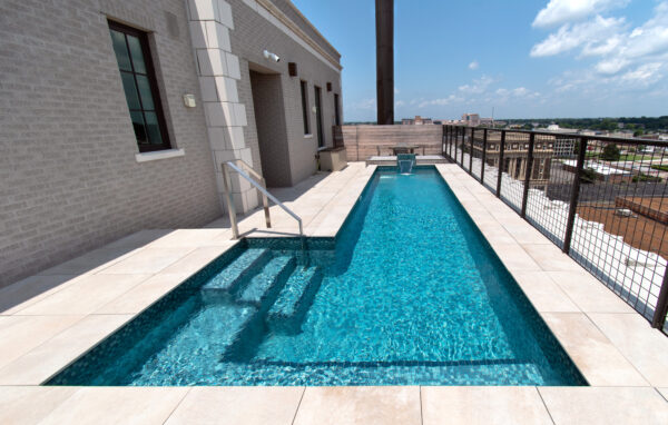 stainless steel rooftop pool with tile and stairs